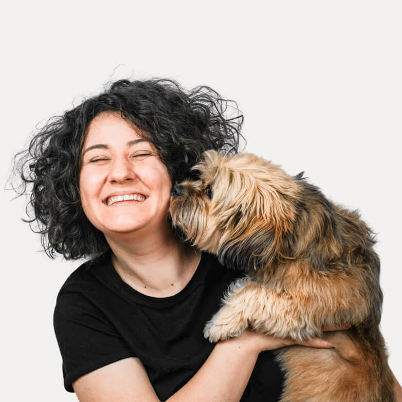 woman smiling with dogs